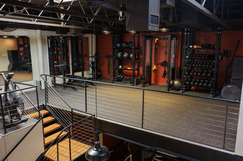 Modern multi-level fitness facility with premium training equipment at Home Mountain in West LA
